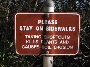 Stay on sidewalks sign (American Trails photo)